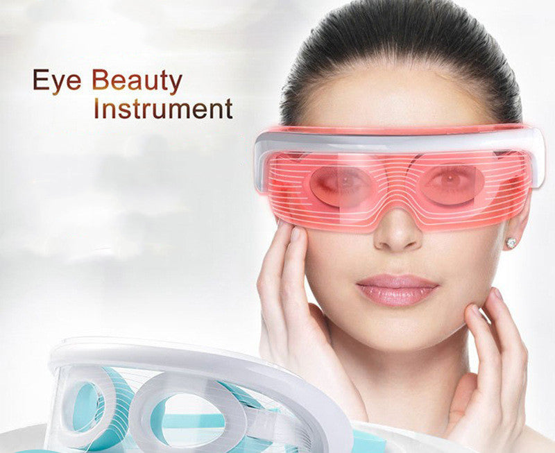 Woman using LED eye massager